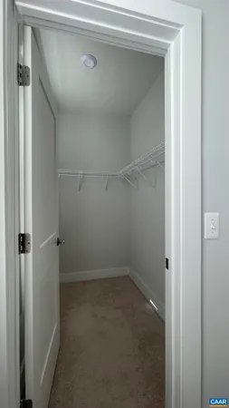 a bathroom with a granite countertop sink vanity and a mirror