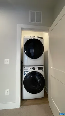 a bathroom with a granite countertop sink a toilet and a mirror