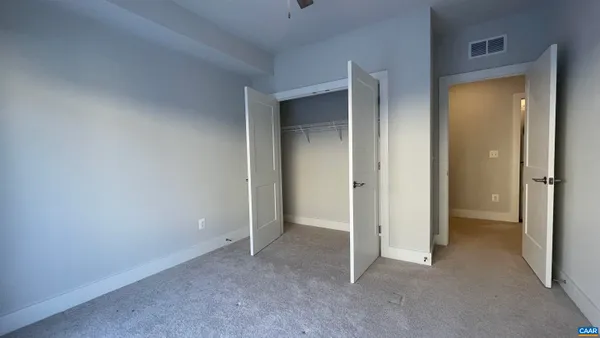 a view of a balcony with wooden fence