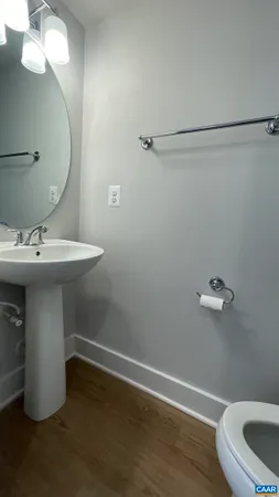 a bathroom with a sink and mirror