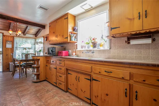 a kitchen with stainless steel appliances granite countertop sink and cabinets