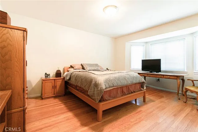 a spacious bedroom with a bed and furniture