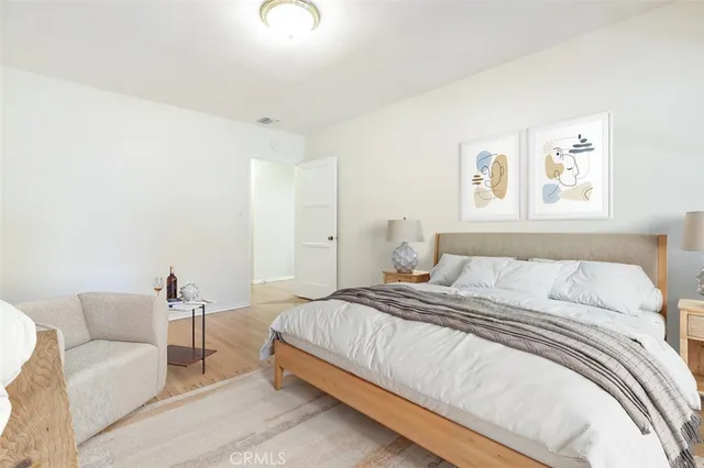 a bedroom with a bed and a couch