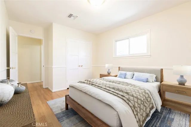 a bedroom with a bed and a window