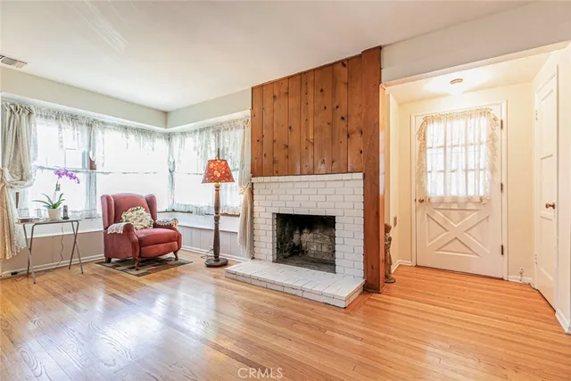 a bedroom with furniture and a fireplace