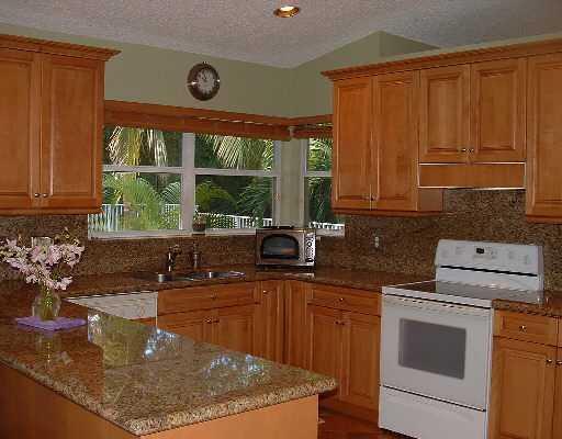 19714 Black Olive Lane Boca Raton, FL 33498 - Photo 2 of 6 a kitchen with a sink a stove and cabinets
