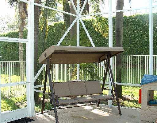 19714 Black Olive Lane Boca Raton, FL 33498 - Photo 5 of 6 a view of a chair and tables in the balcony