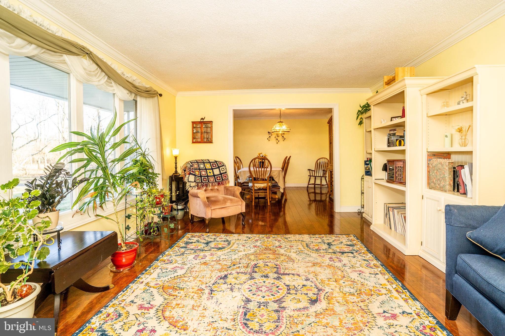 181 Edgebrook Road Robbinsville, NJ 08691 - Photo 13 of 67 a very nice looking living room with a large window and potted plants