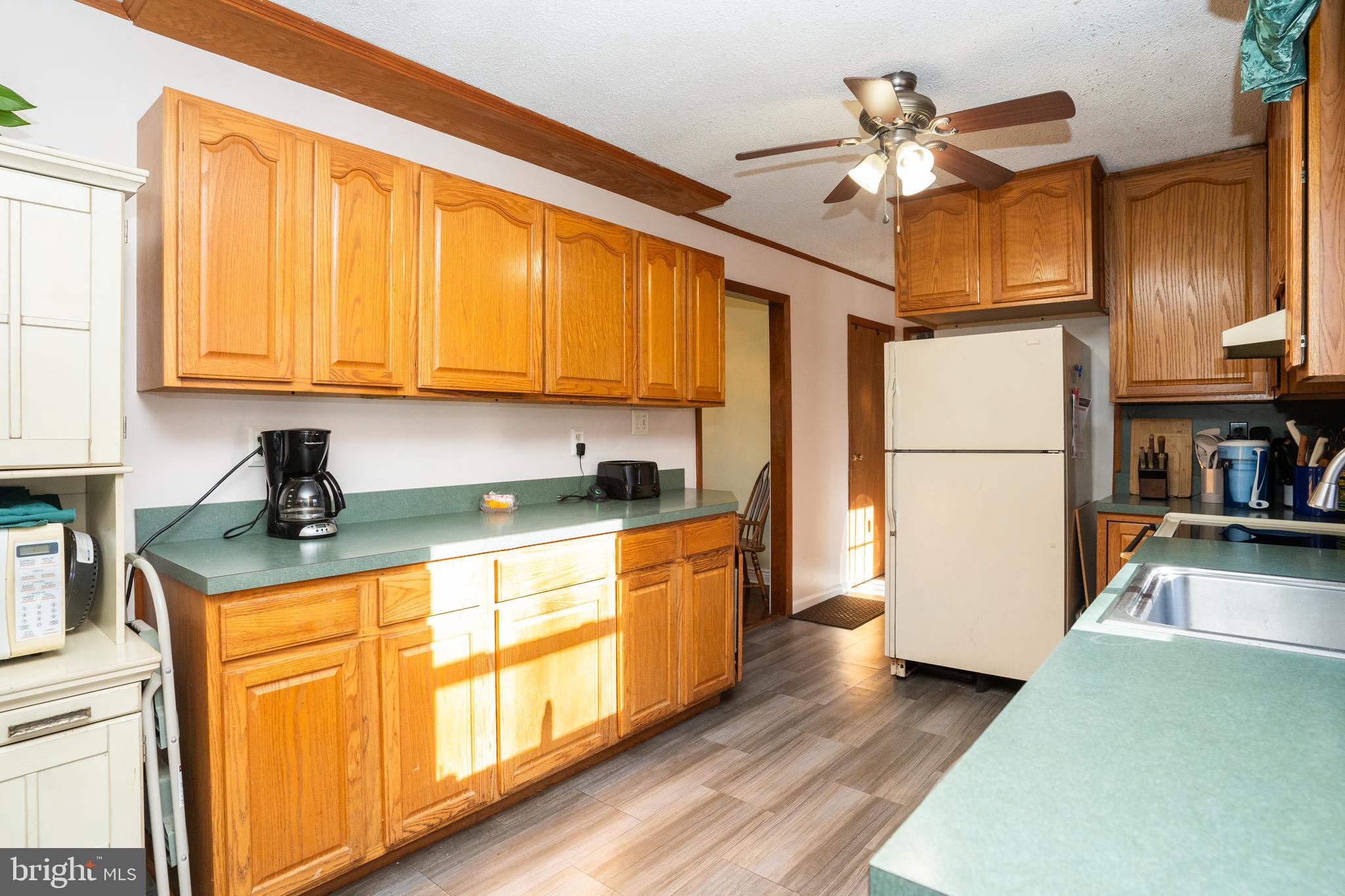 181 Edgebrook Road Robbinsville, NJ 08691 - Photo 14 of 67 a kitchen with stainless steel appliances granite countertop a refrigerator a stove and a sink with cabinets
