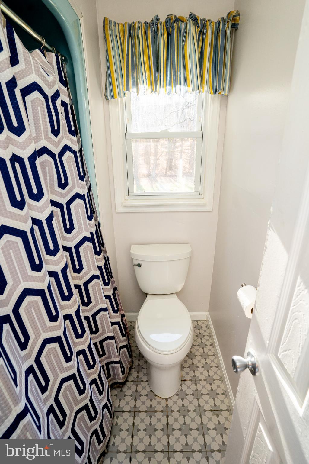 181 Edgebrook Road Robbinsville, NJ 08691 - Photo 18 of 67 a bathroom with a toilet and a shower curtain