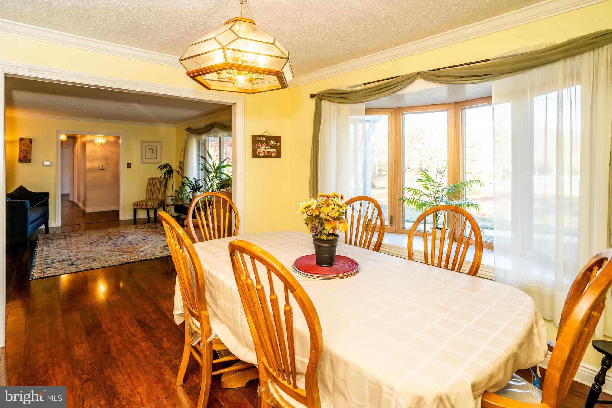 181 Edgebrook Road Robbinsville, NJ 08691 - Photo 39 of 67 a view of a dining room with furniture and chandelier