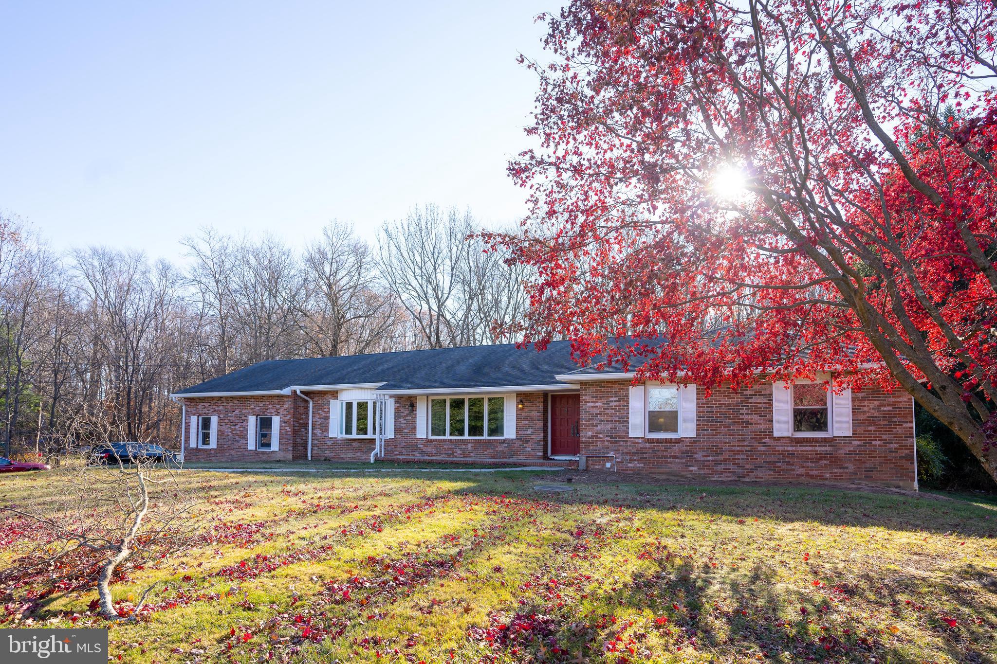 181 Edgebrook Road Robbinsville, NJ 08691 - Photo 4 of 67 a red brick house with trees in front of it