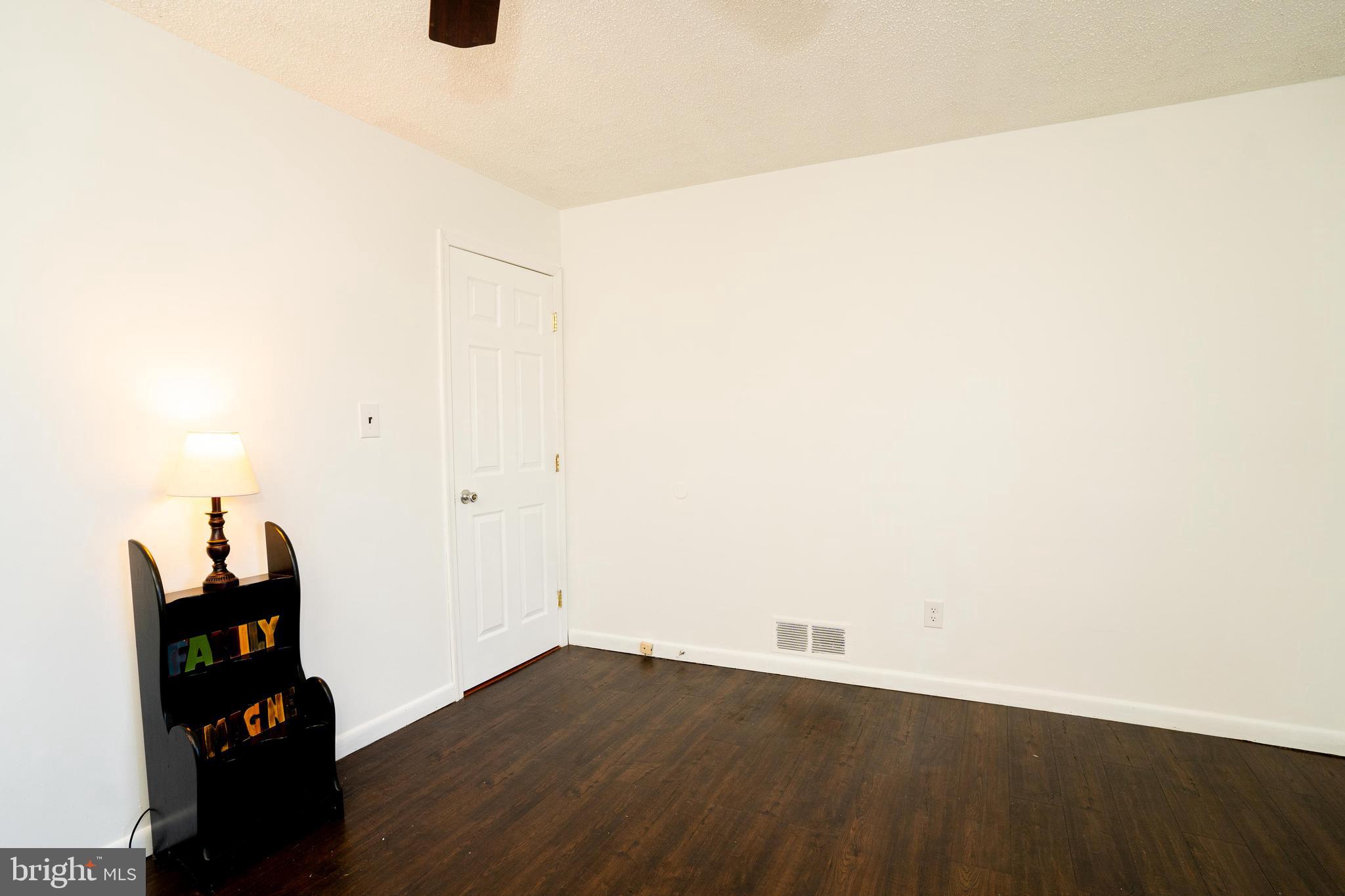 181 Edgebrook Road Robbinsville, NJ 08691 - Photo 42 of 67 an empty room with wooden floor