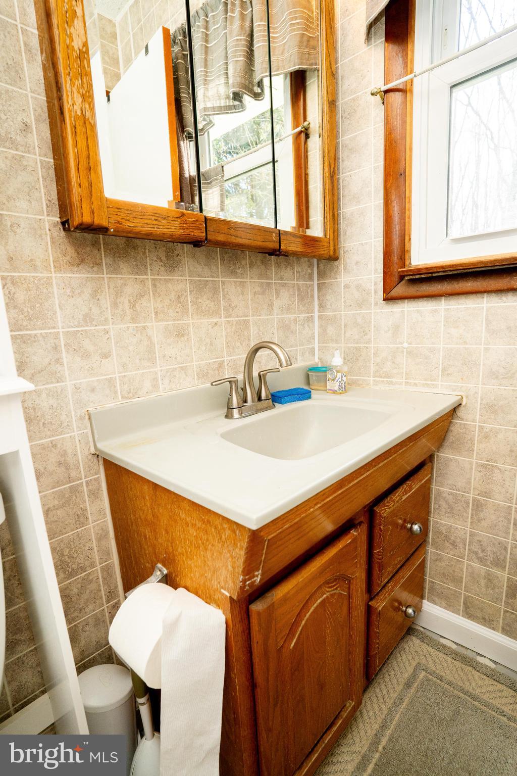 181 Edgebrook Road Robbinsville, NJ 08691 - Photo 48 of 67 a bathroom with a sink a toilet and mirror