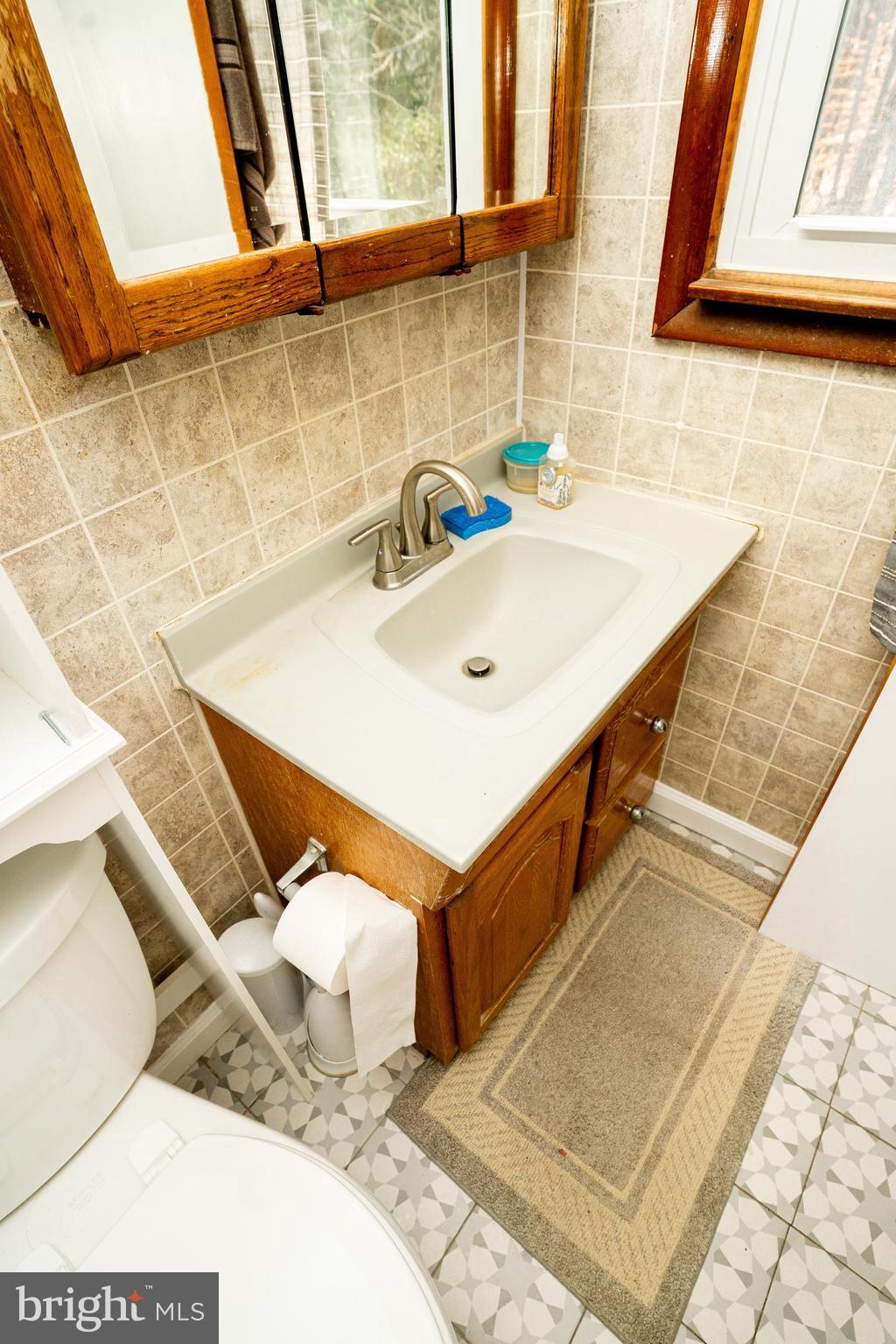 181 Edgebrook Road Robbinsville, NJ 08691 - Photo 49 of 67 a bathroom with a sink and a mirror