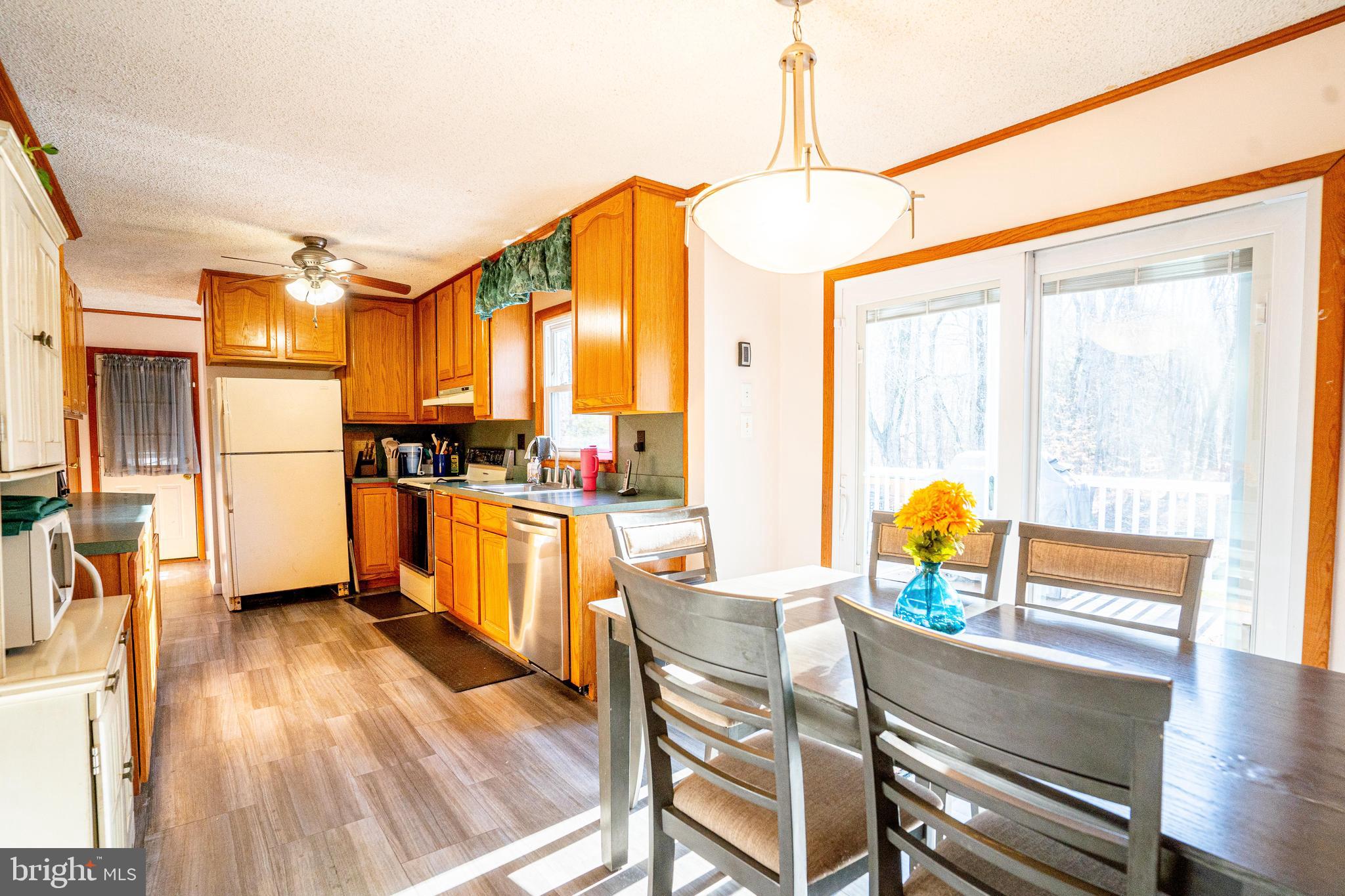 181 Edgebrook Road Robbinsville, NJ 08691 - Photo 54 of 67 a kitchen view with a table chairs refrigerator and stove