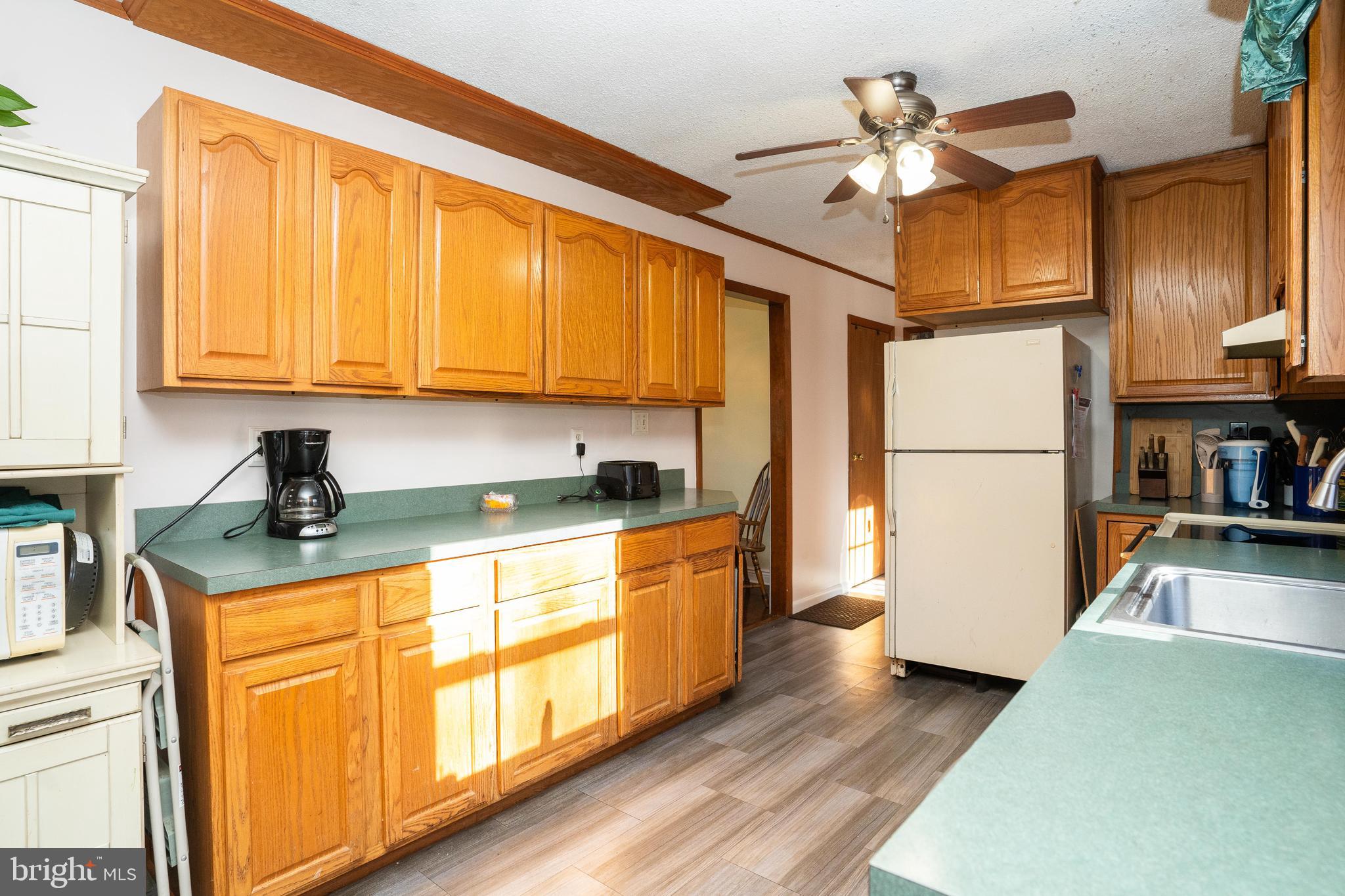 181 Edgebrook Road Robbinsville, NJ 08691 - Photo 56 of 67 a kitchen with stainless steel appliances granite countertop a refrigerator a stove and a sink with cabinets