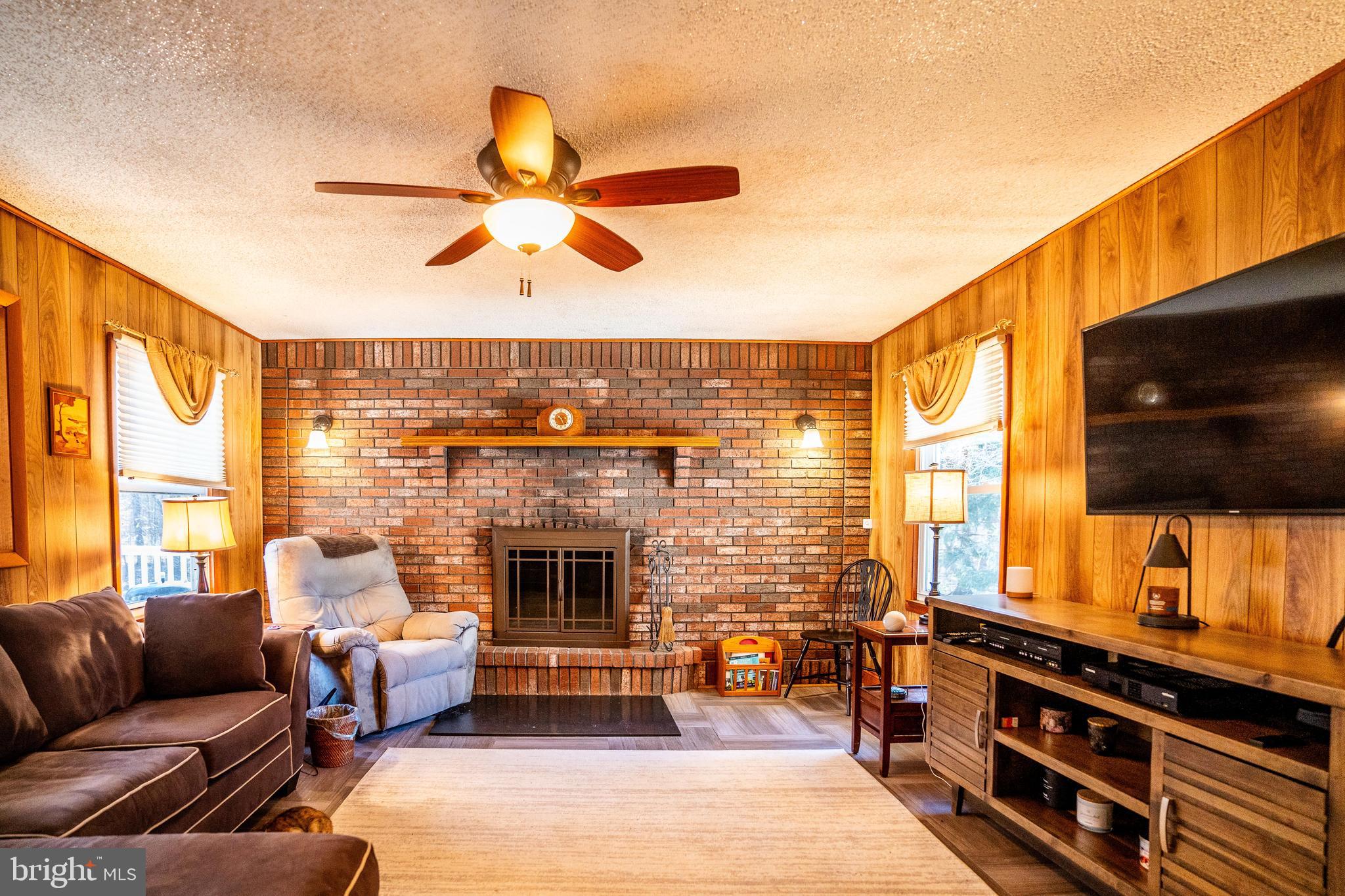 181 Edgebrook Road Robbinsville, NJ 08691 - Photo 60 of 67 a living room with furniture and a flat screen tv