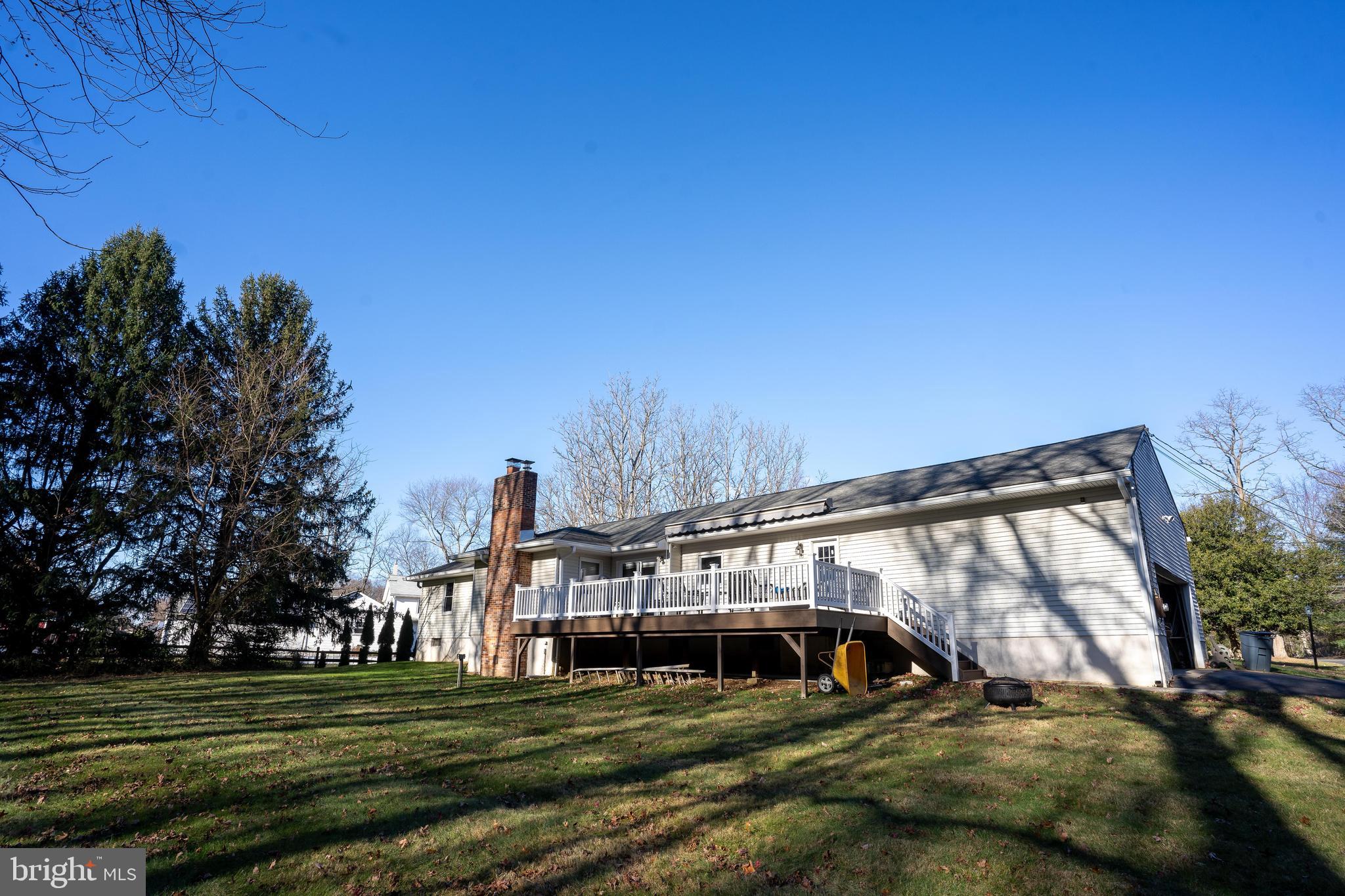 181 Edgebrook Road Robbinsville, NJ 08691 - Photo 6 of 67 a view of a big house with a big yard and large trees