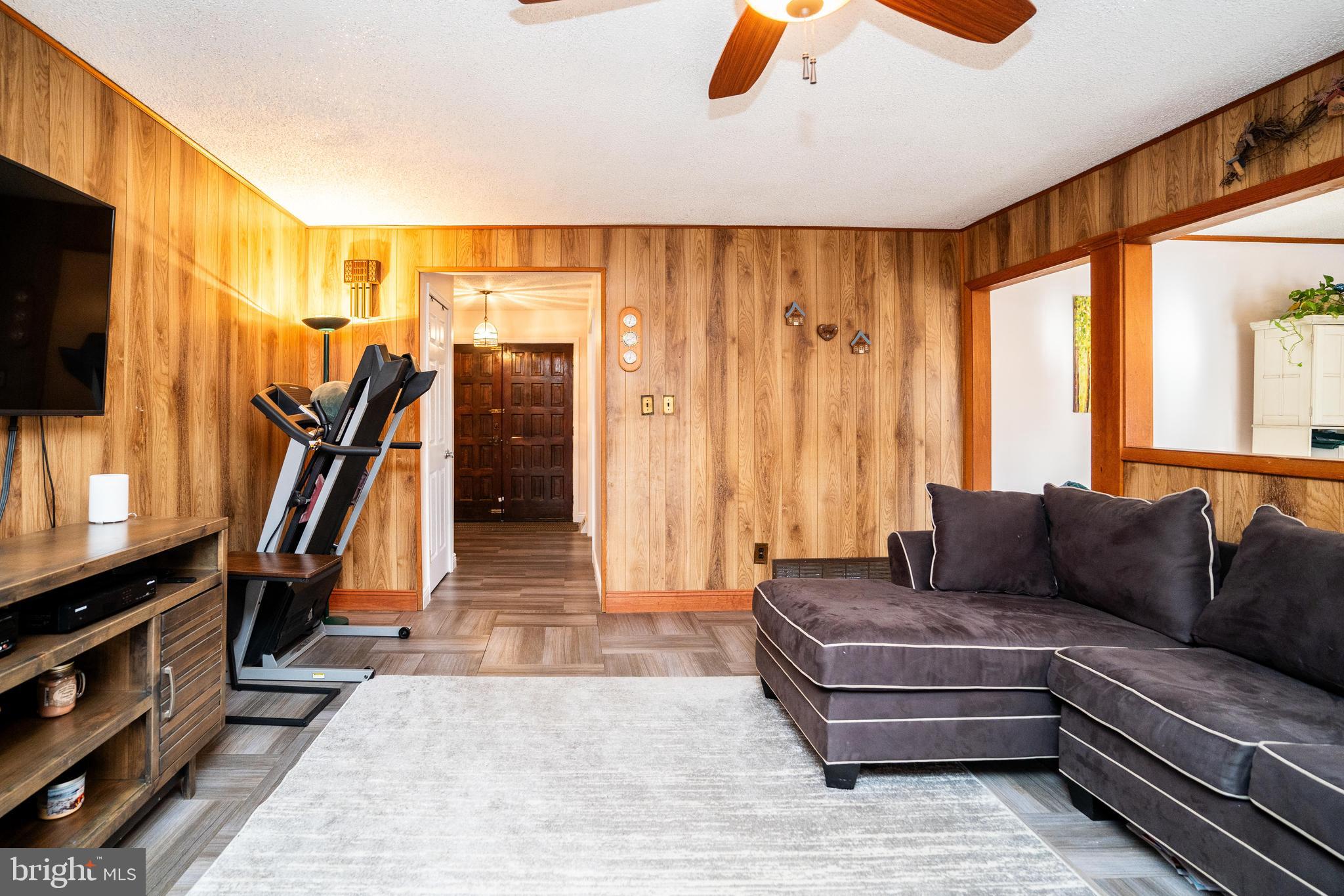181 Edgebrook Road Robbinsville, NJ 08691 - Photo 64 of 67 a living room with furniture and a flat screen tv