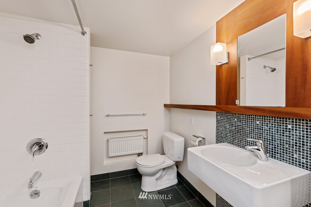 428 Northwest 45th Street Seattle, WA 98107 - Photo 14 of 26 a bathroom with a sink a toilet and shower