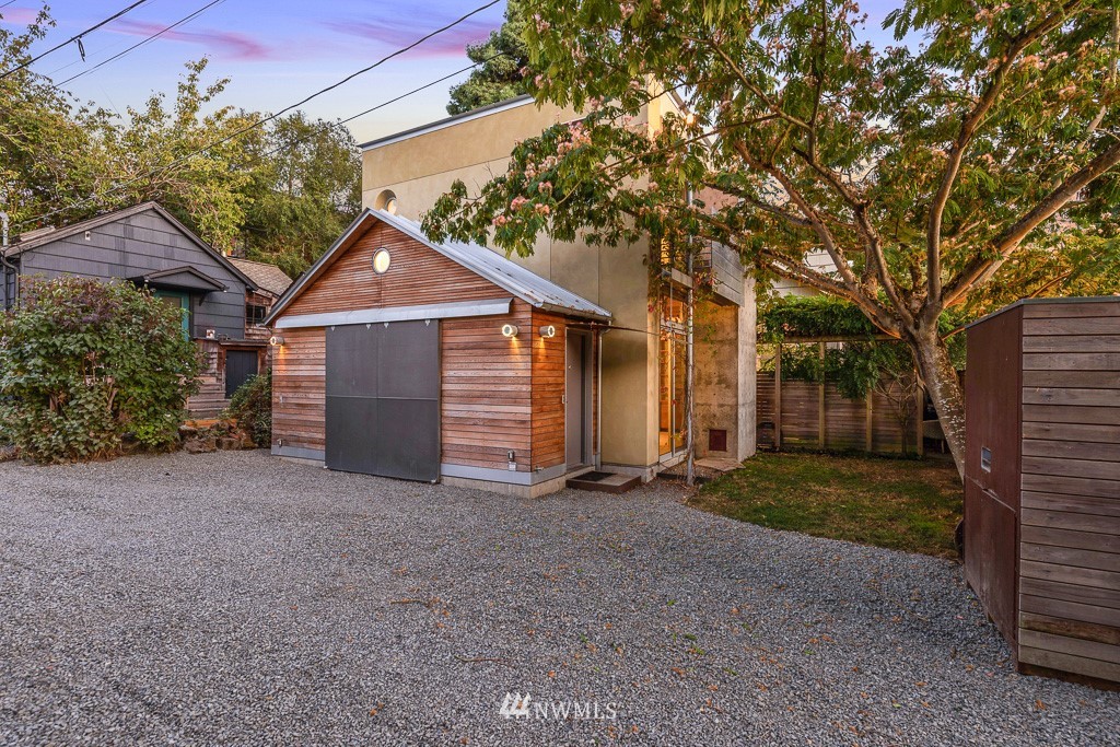 428 Northwest 45th Street Seattle, WA 98107 - Photo 3 of 26 a front view of a house with a yard and garage