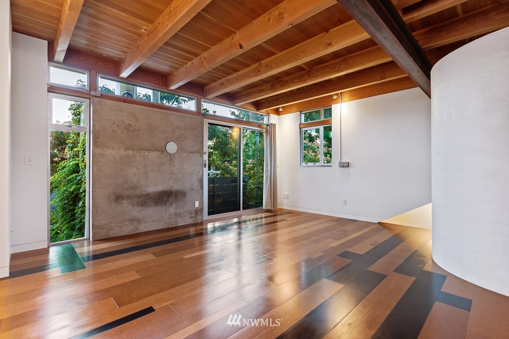 428 Northwest 45th Street Seattle, WA 98107 - Photo 21 of 26 a view of an empty room with wooden floor and a window