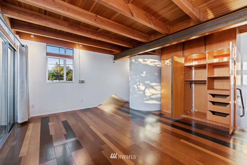 428 Northwest 45th Street Seattle, WA 98107 - Photo 25 of 26 a view of an empty room with wooden floor and a window