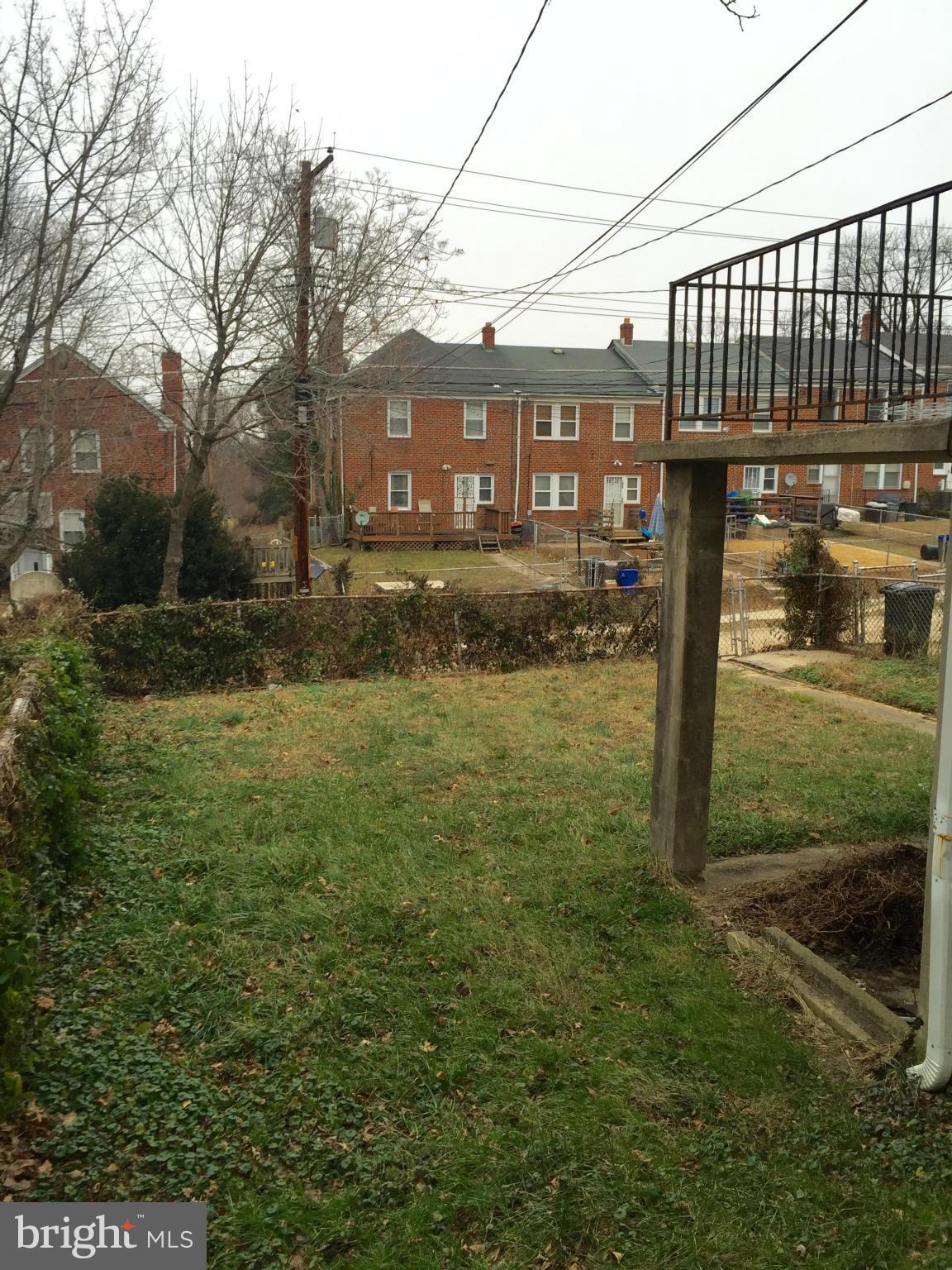 980 Masefield Road Baltimore, MD 21207 - Photo 4 of 5 a view of a house with a yard