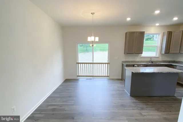 a view of a kitchen with a dishwasher and a window