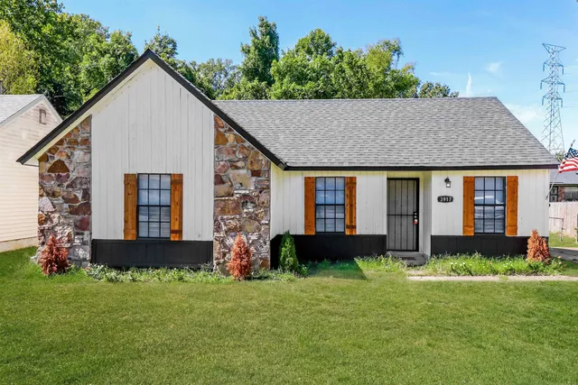 a front view of a house with garden
