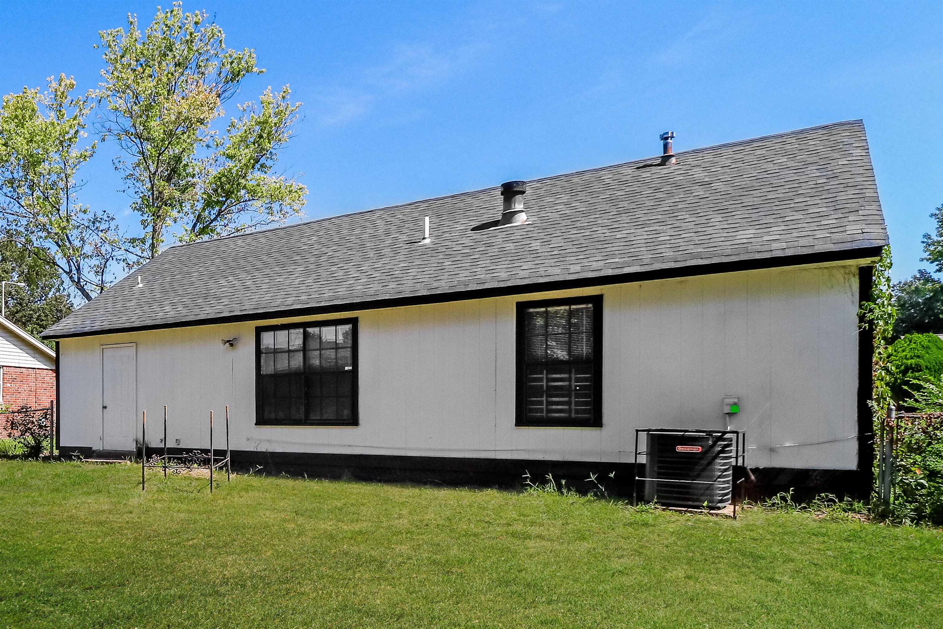 3917 Kerwin Drive Memphis, TN 38128 - Photo 16 of 16 a front view of a house with garden
