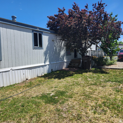 3760 Gold Ridge Drive, Unit 82 Magna, UT 84044 - Photo 6 of 29 Light-colored siding exterior with dark trim accents