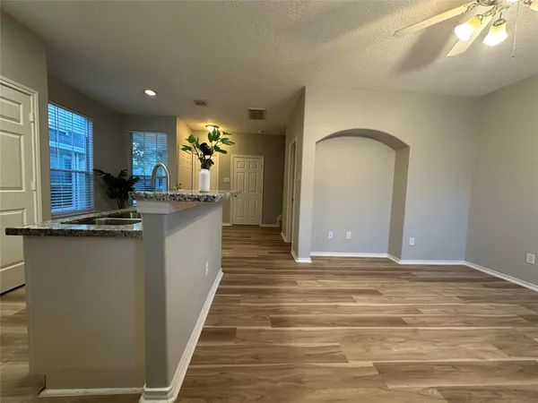 a view of kitchen and kitchen with wooden floor