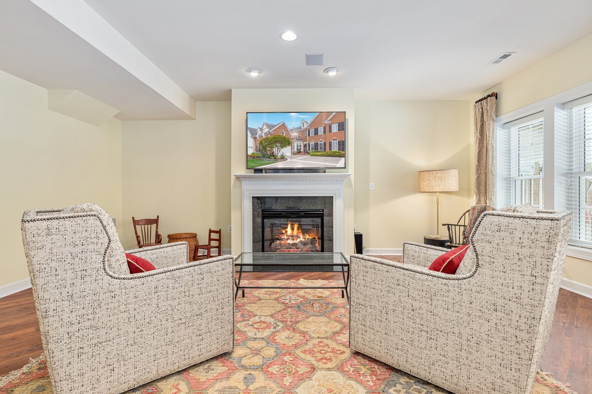 19194 Greystone Square Leesburg, VA 20176 - Photo 47 of 96 Cozy fireplace and TV conveys!