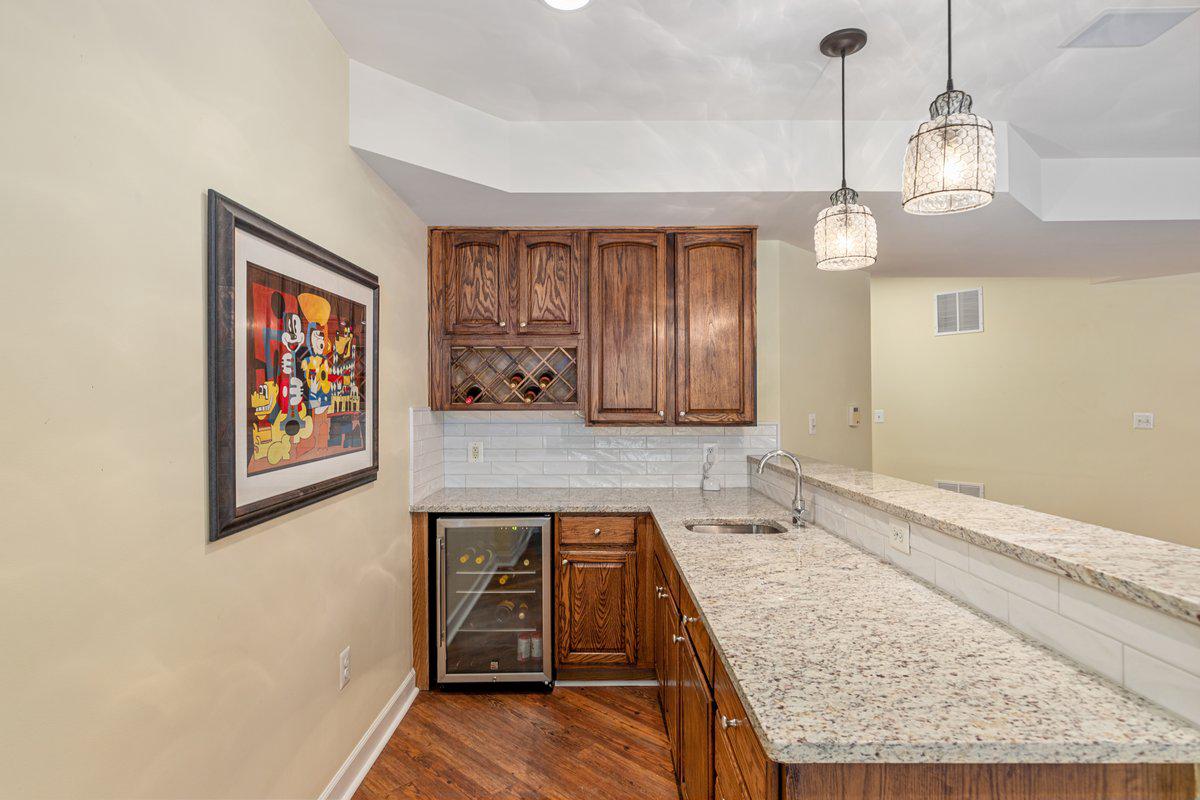 19194 Greystone Square Leesburg, VA 20176 - Photo 52 of 96 Wine frig and sink for ease of entertaining
