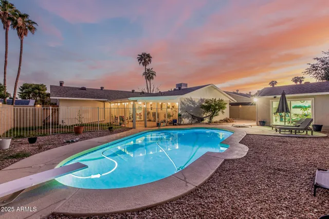a view of a swimming pool with a patio