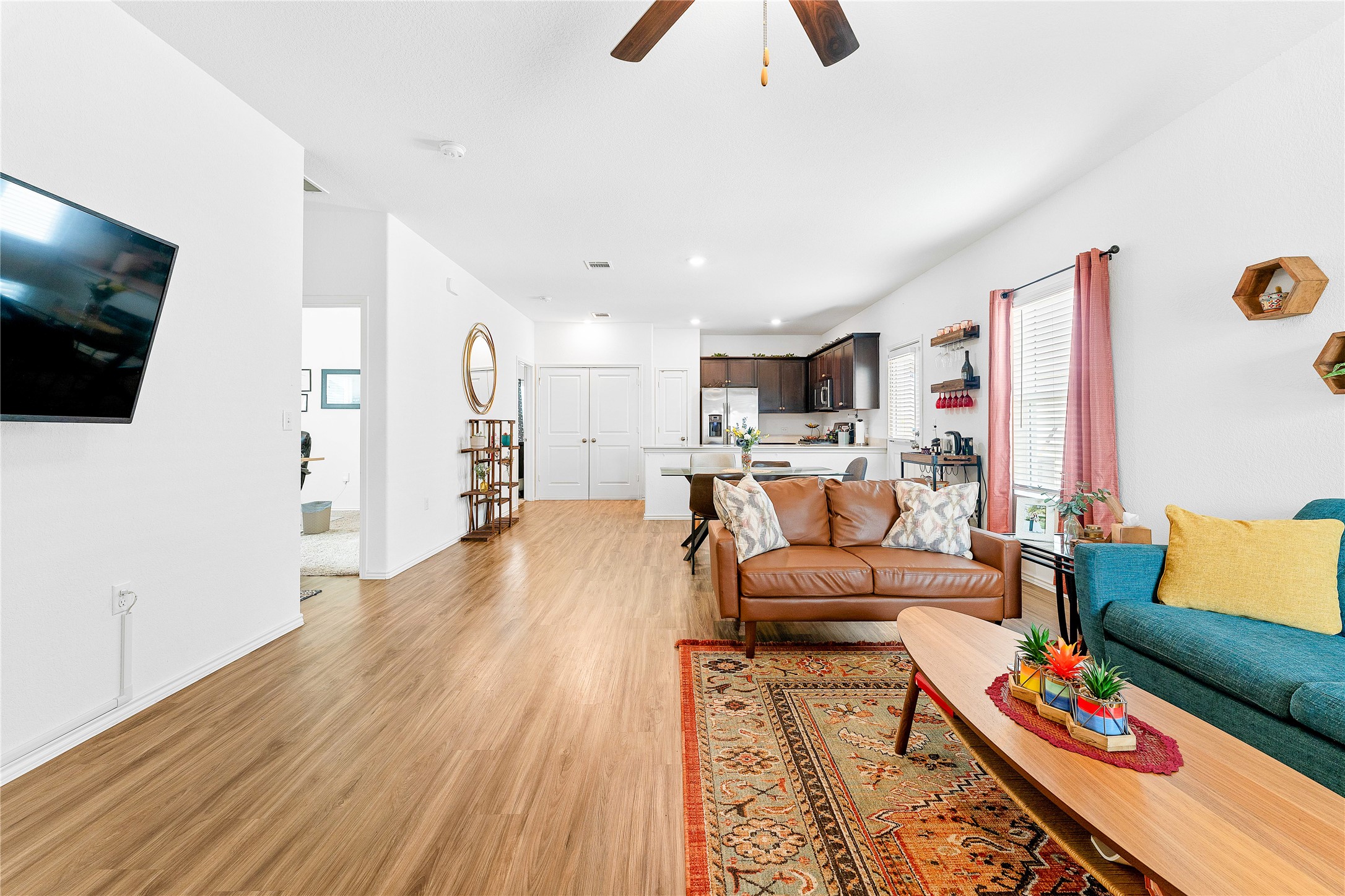 6009 Jagger Avenue Austin, TX 78747 - Photo 2 of 24 a living room with furniture and a flat screen tv