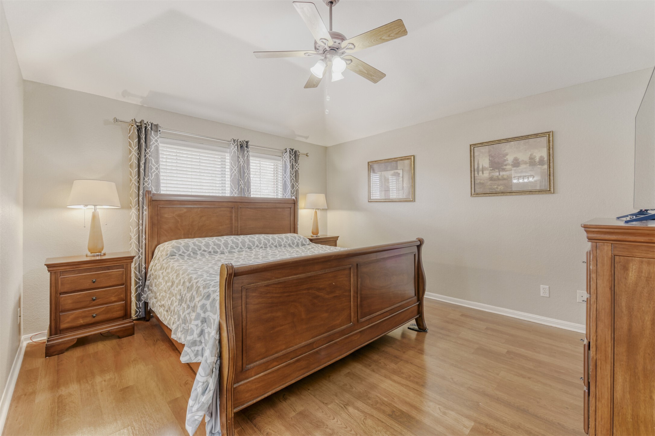104 Spring Branch Bastrop, TX 78602 - Photo 22 of 32 Bedroom featuring light wood finished floors, ceiling fan, and vaulted ceiling