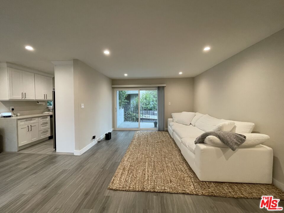 1051 South Sherbourne Drive, Unit 3 Los Angeles, CA 90035 - Photo 1 of 16 a living room with furniture and a window