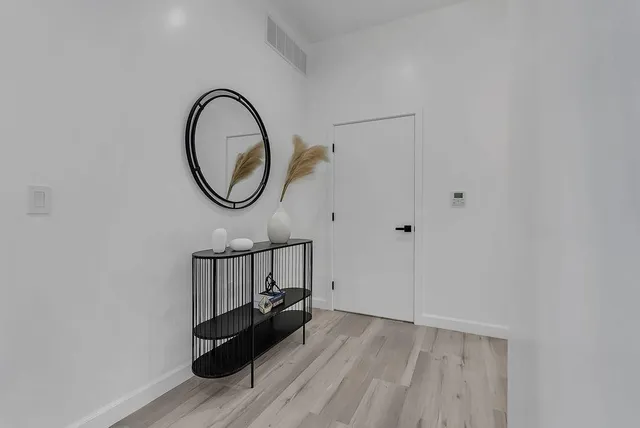 a white toilet sitting next to a bath tub