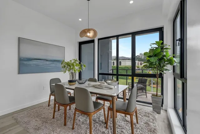 a view of a dining room with furniture window and outside view