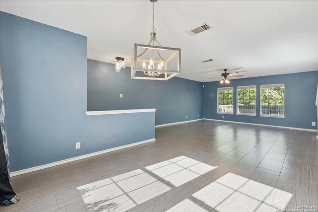 a view of a big room with windows