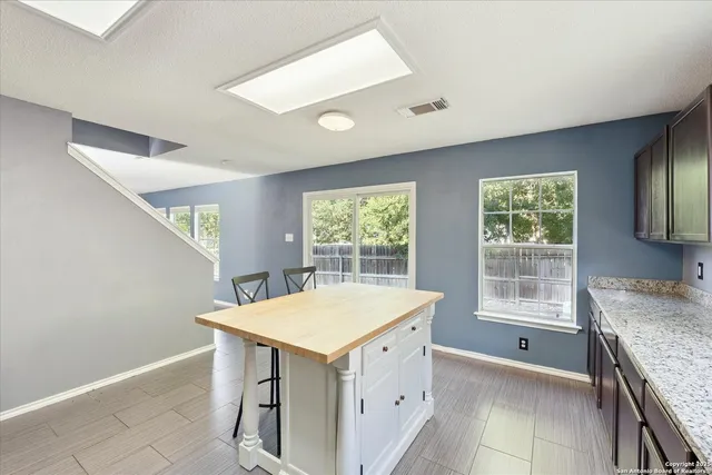 a kitchen that has a sink and a stove in it