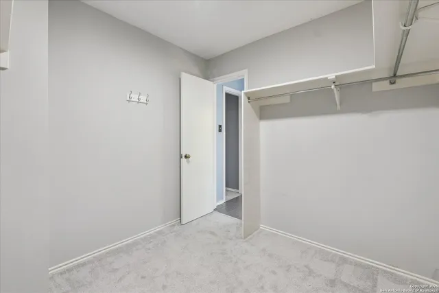 a view of an empty walk in closet