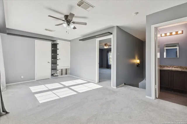 a view of livingroom with hardwood floor and a ceiling fan
