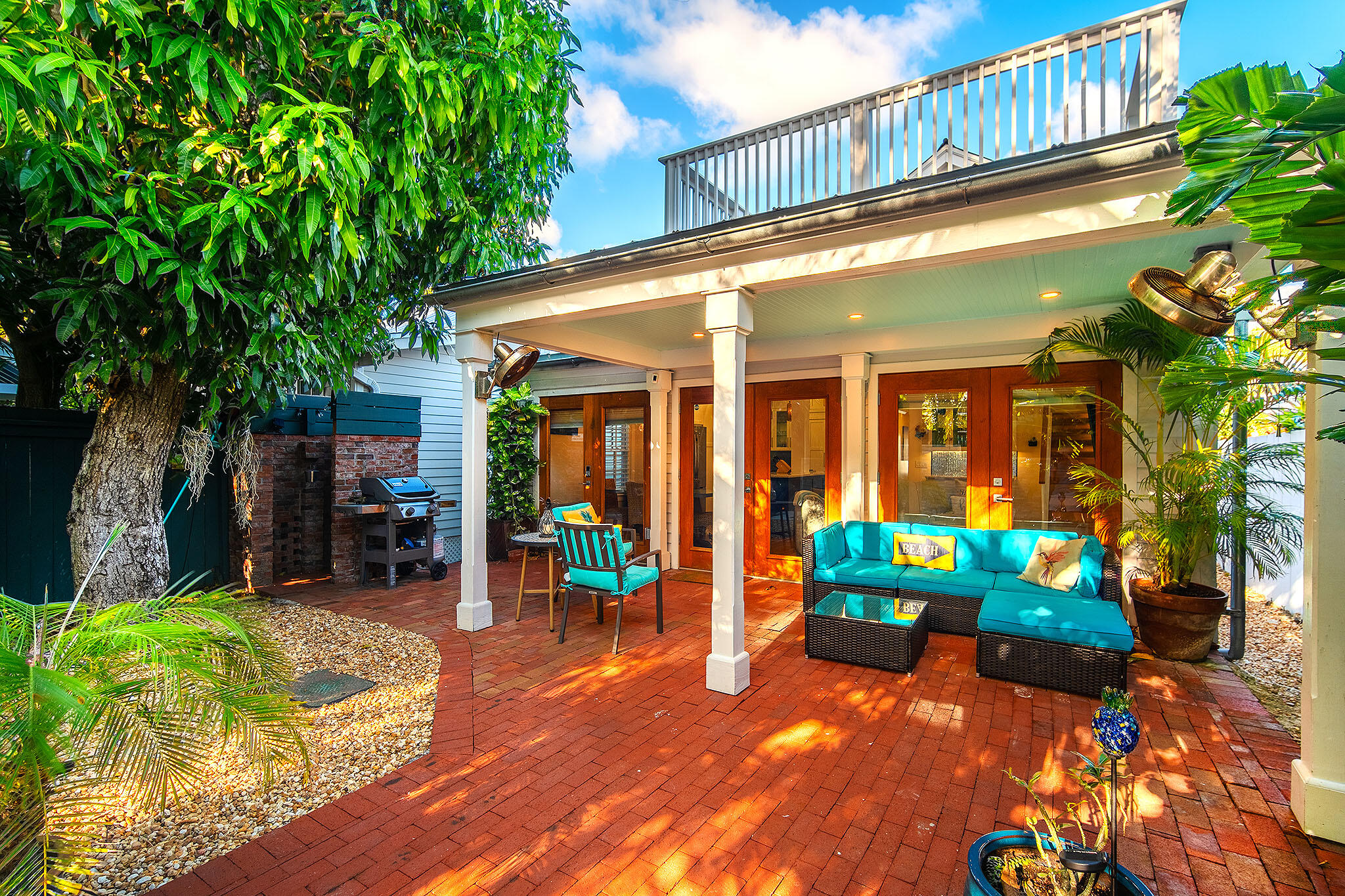 1116 Packer Street Key West, FL 33040 - Photo 21 of 57 a view of a chairs and table in the patio