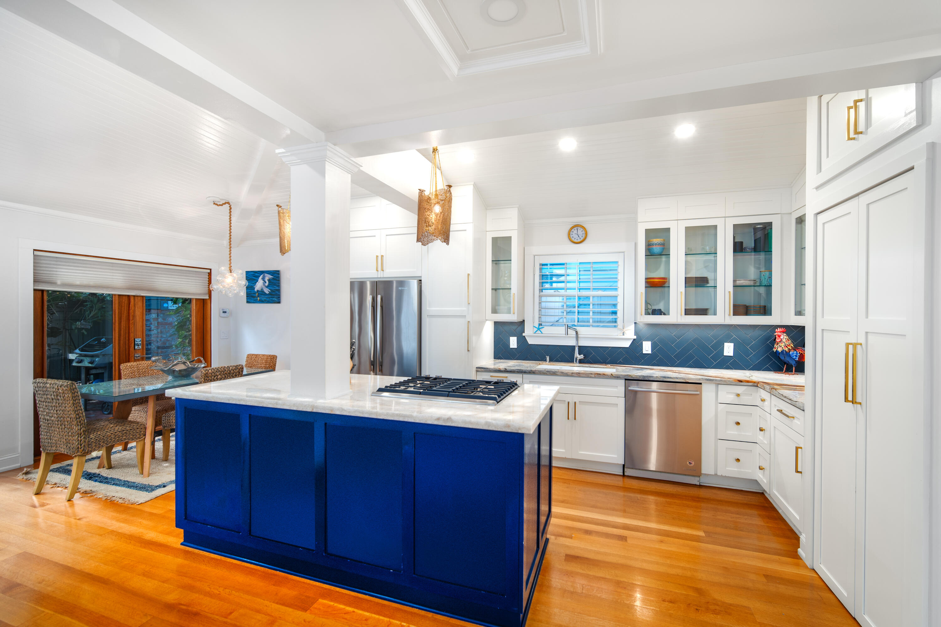 1116 Packer Street Key West, FL 33040 - Photo 30 of 57 a kitchen with stainless steel appliances granite countertop wooden cabinets and a stove