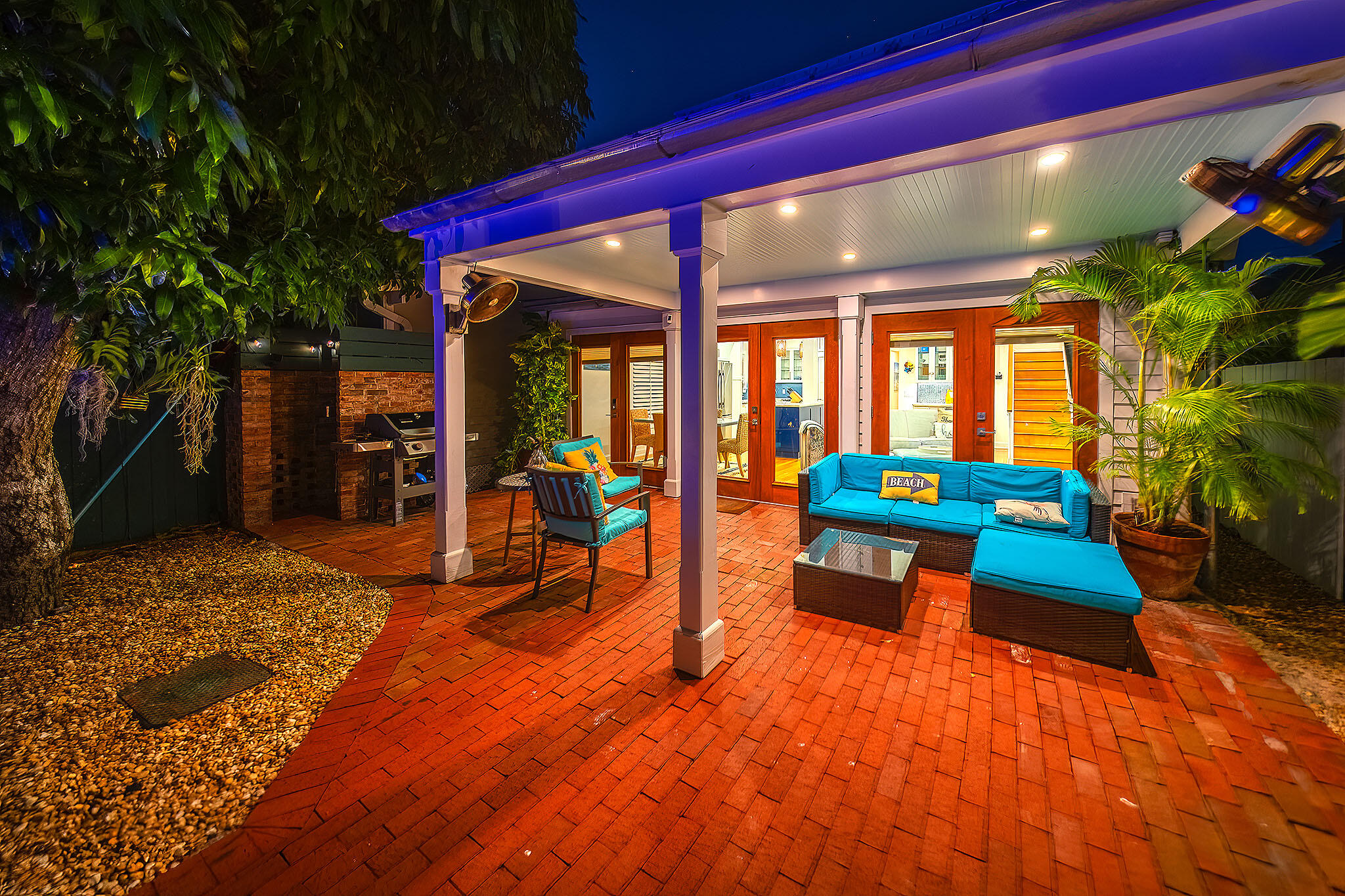 1116 Packer Street Key West, FL 33040 - Photo 3 of 57 a living room filled with furniture and a swimming pool