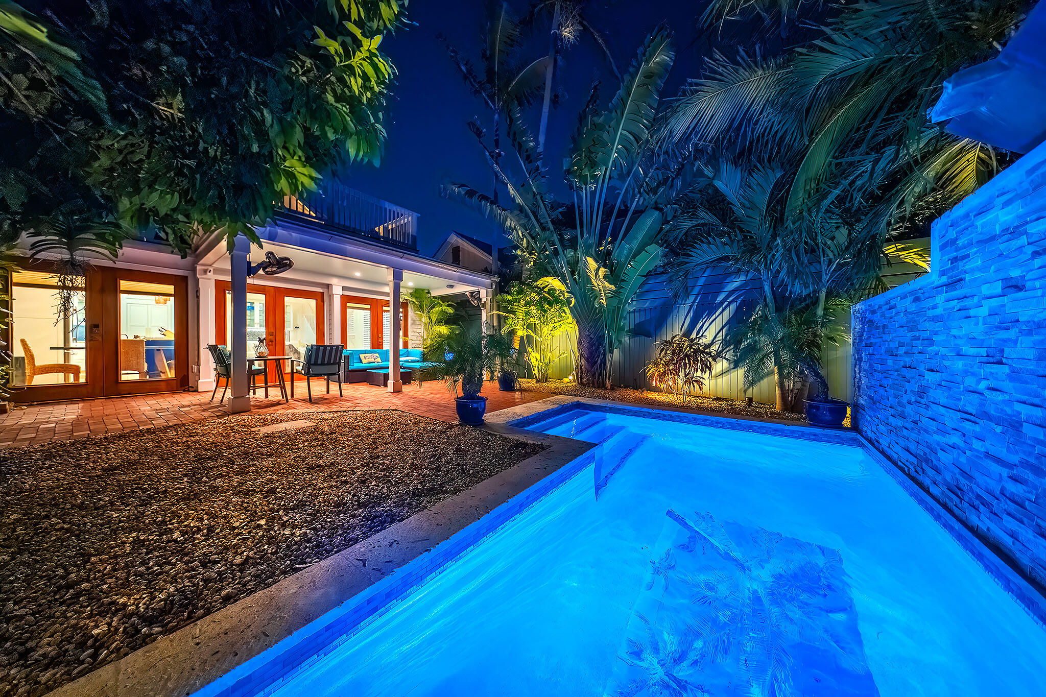 1116 Packer Street Key West, FL 33040 - Photo 4 of 57 a view of a backyard with large trees